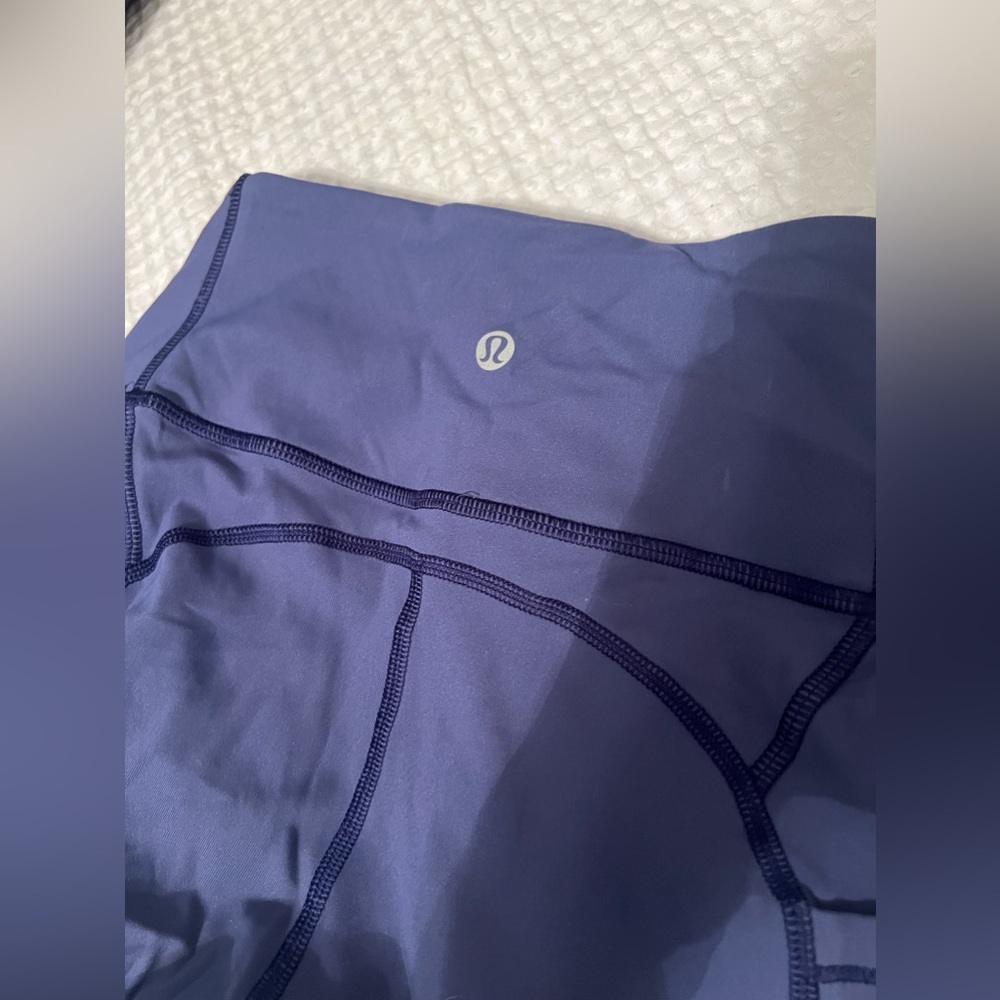 Lululemon leggings purple, side pockets for phone.